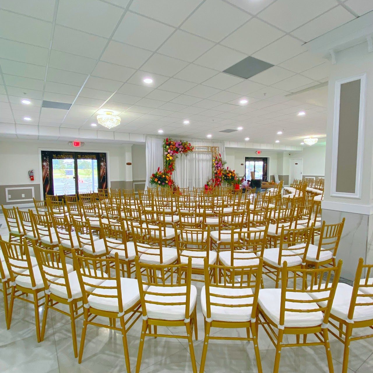 Reception area with ambient lighting and floral centerpieces.