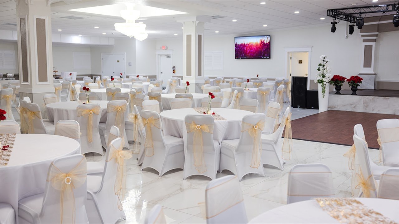 Reception floor and stage setup from a second ballroom angle inside M and N Event Hall
